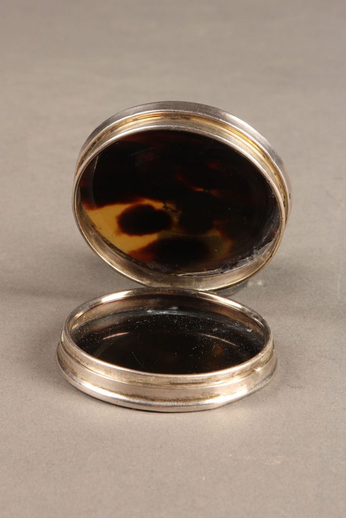 Antique English snuff box made from tortoise shell and sterling silver.