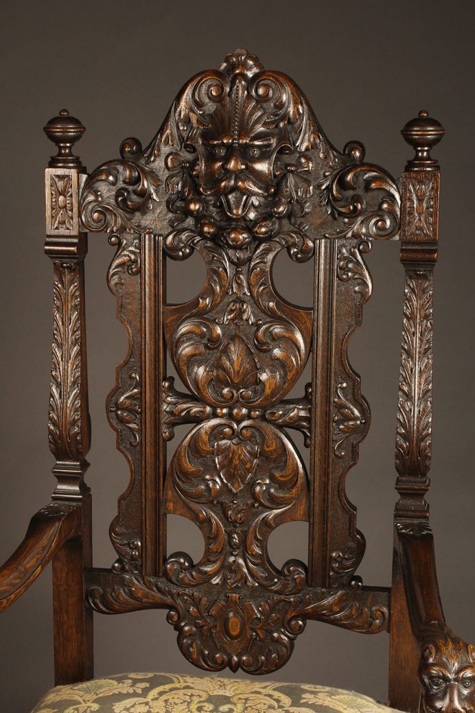 Antique pair of Belgian hand carved oak arm chairs.