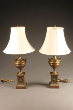 Nice pair of brass urn shaped lamps with silk shades.