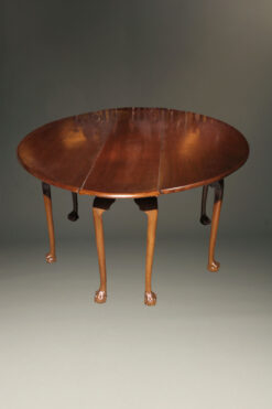 Mahogany Irish wake table with double drop leaves and gatelegs with hand carved ball and claw feet.