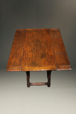 Custom English Jacobean style side draw leaf table in oak.