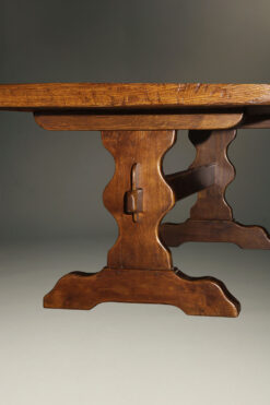 Custom English oak farmhouse table with wood pegged mortise and tenon joinery and hand hewn top.