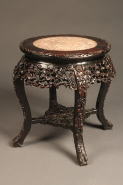Heavily carved low Chinese table in rosewood with inset marble top