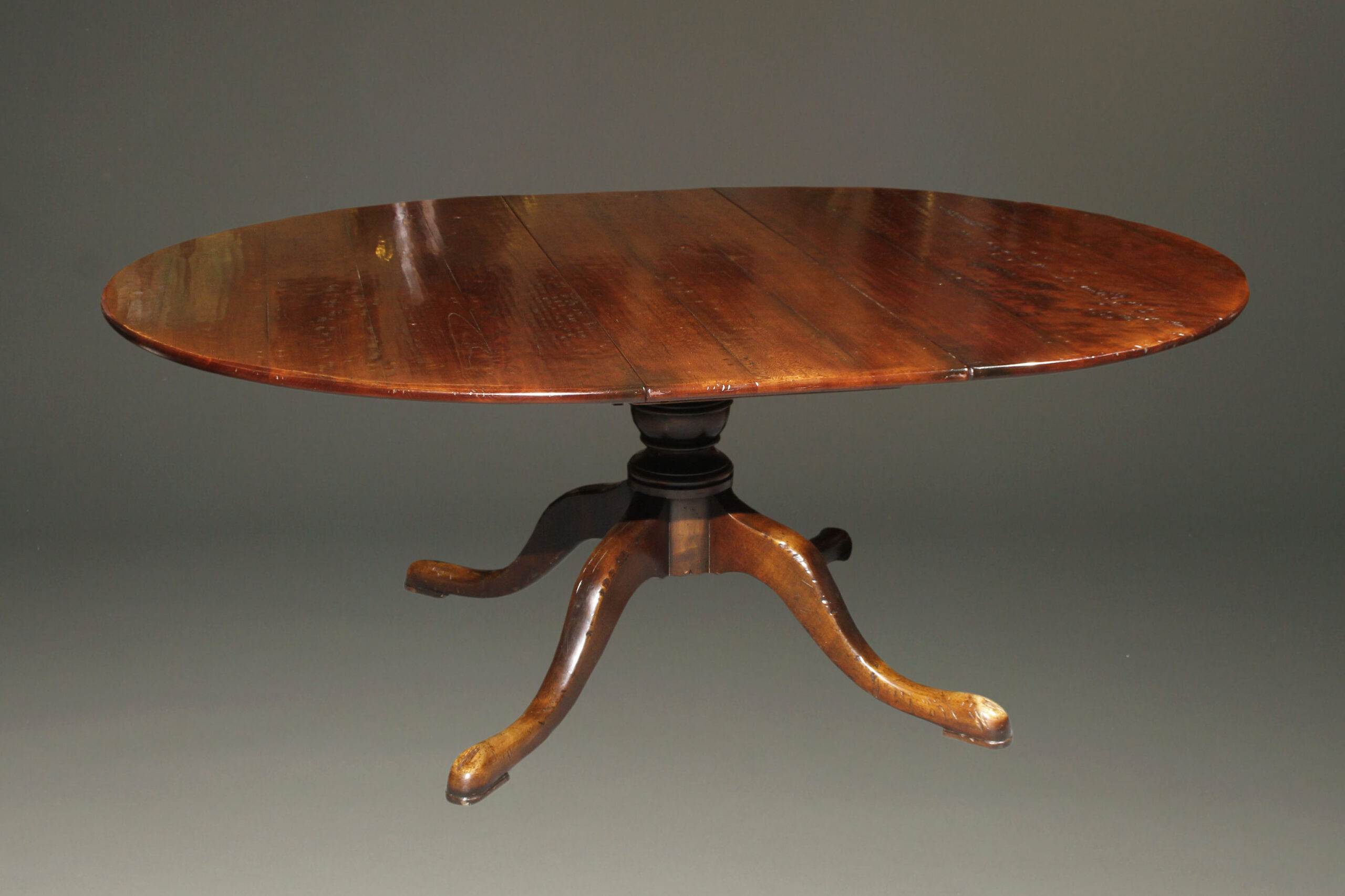 Custom made 18th century English styled farmhouse table in cherry wood with two 18" leaves.