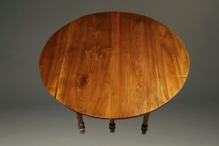 19th century French walnut kitchen table with drop leaves and fluted feet