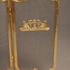 Solid brass folding fireplace screen with ornate castings.