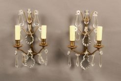 Pair of French 2 arm bronze and crystal sconces.