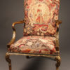 French walnut armchair with ball and claw feet, parcel gilt and handmade tapestry